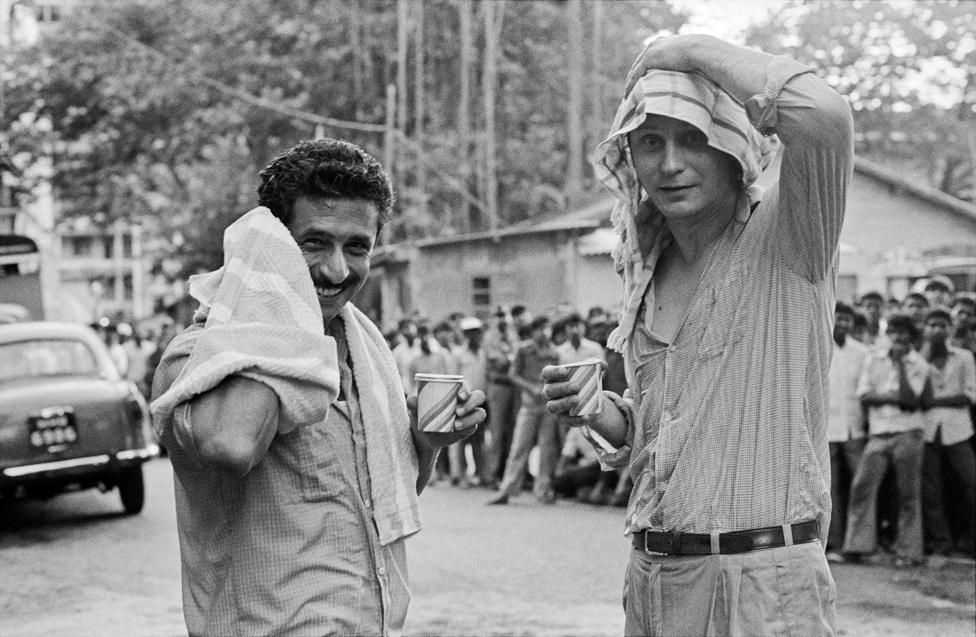 Naseeruddin Shah (left) and Stellan Skarsgard smiling on the sets of a film