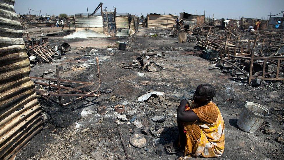 Akki Adduok, a displaced woman residing in the Protection of Civilians (PoC) site in Malakal, South Sudan, sits in the spot where her shelter used to be on February 26, 2016