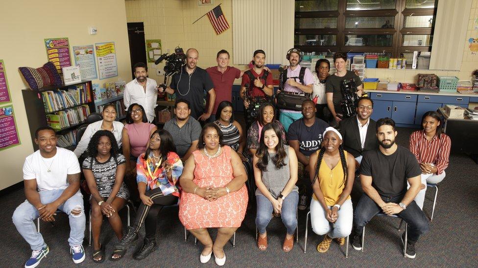 The class of Booker elementary school, sitting for a reunion.