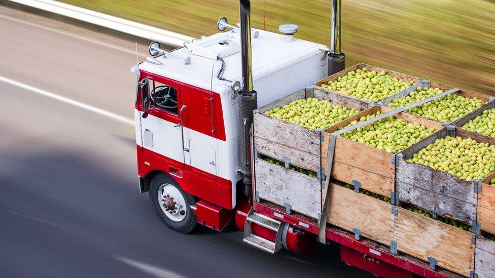 food truck with apples in the back