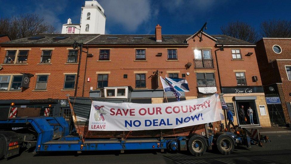 Fishing For Leave banner on a trawler on the back of a lorry