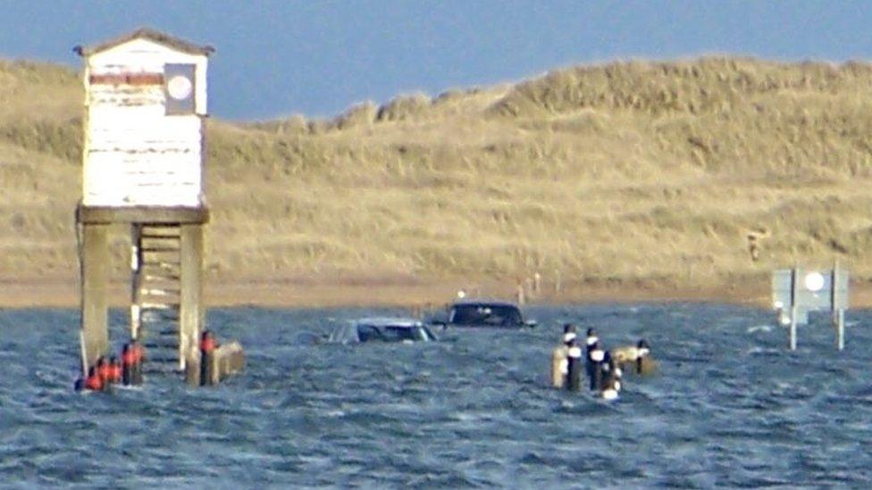 Cars submerged on the Holy Island causeway