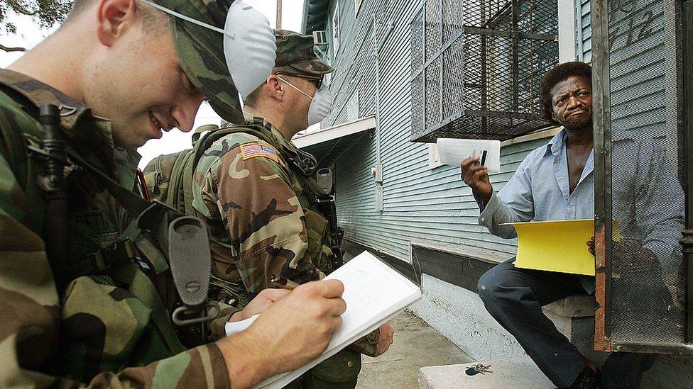 National Guard members talking to a resident in New Orleans