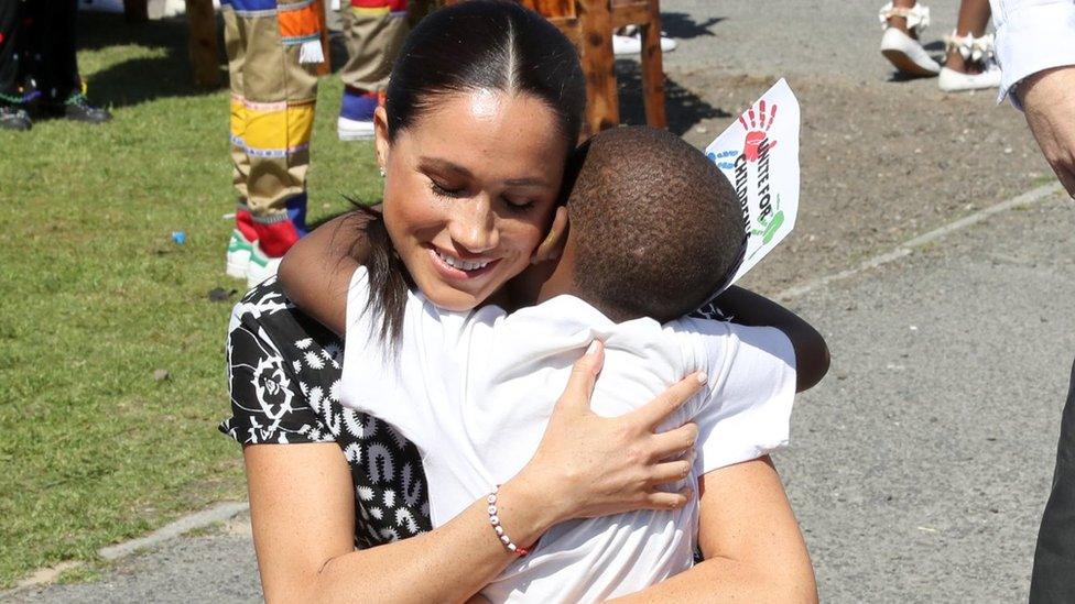 Meghan-hugging-little-boy