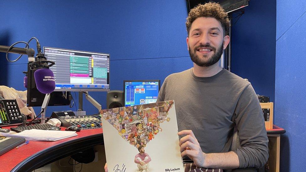 Billy Lockett poses with his new album