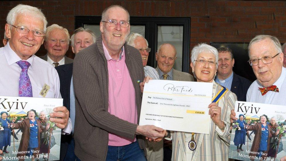 Cheque being presented to the club