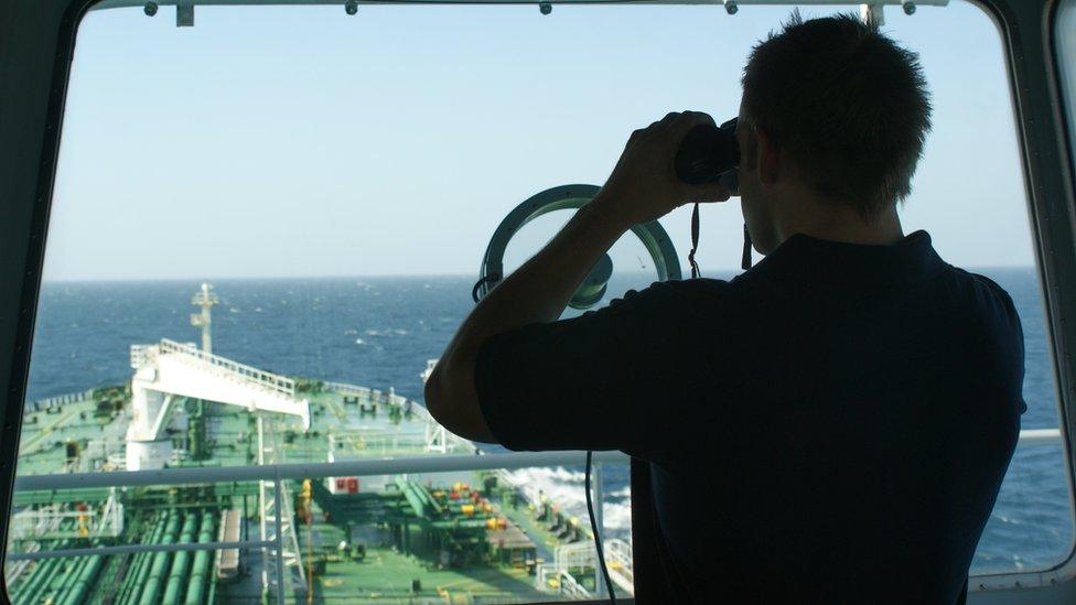 A protection team scan the southern Gulf of Aden for pirates while passing through the High Risk Area