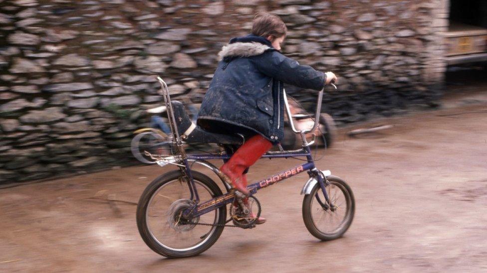 Boy pedalling a Raleigh Chopper