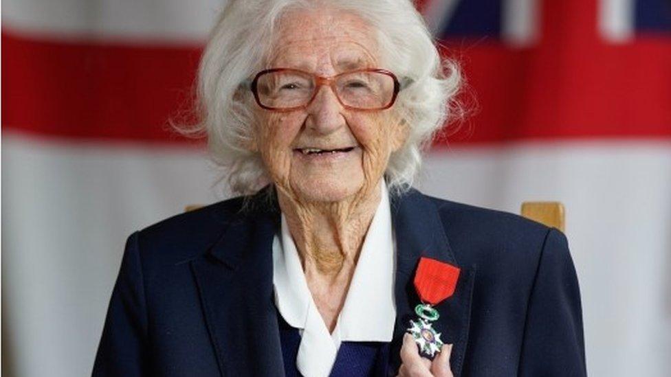 Lorna Cockayne smiling and wearing her medal