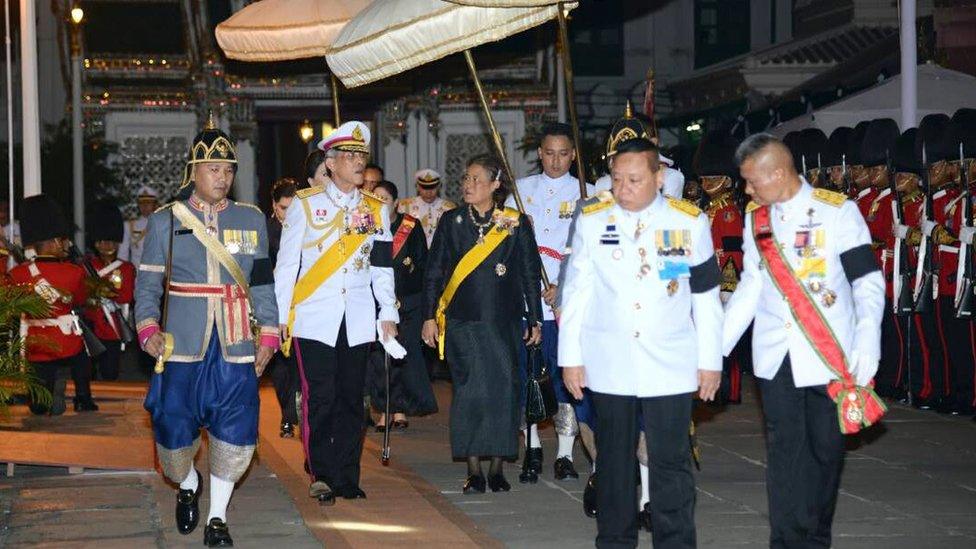 A royal handout photo shows Thai Crown Prince Maha Vajiralongkorn (2nd L) and Princess Maha Chakri Sirindhorn (C) arrive for the royal bathing ceremony for the late king 14 October