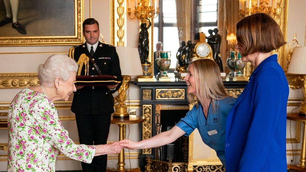 Queen Elizabeth presents the George Cross to Caroline Lamb, chief executive NHS Scotland, and Eleanor Grant, Palliative Care Nurse, Specialist University Hospital Wishaw, NHS Lanarkshire