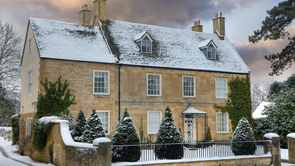 house with snow on roof