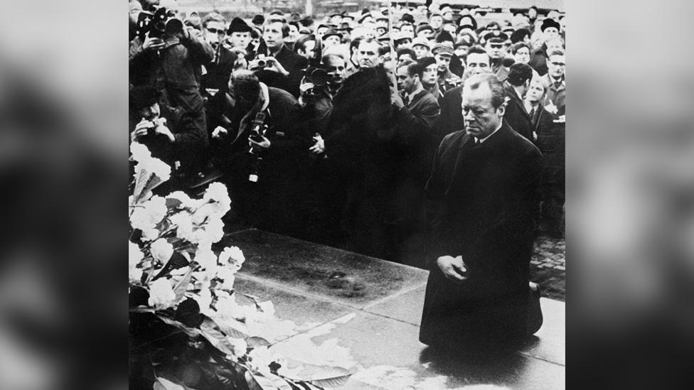 German Chancellor Willy Brandt falls to his knees before the monument to the Warsaw Ghetto uprising of 1943