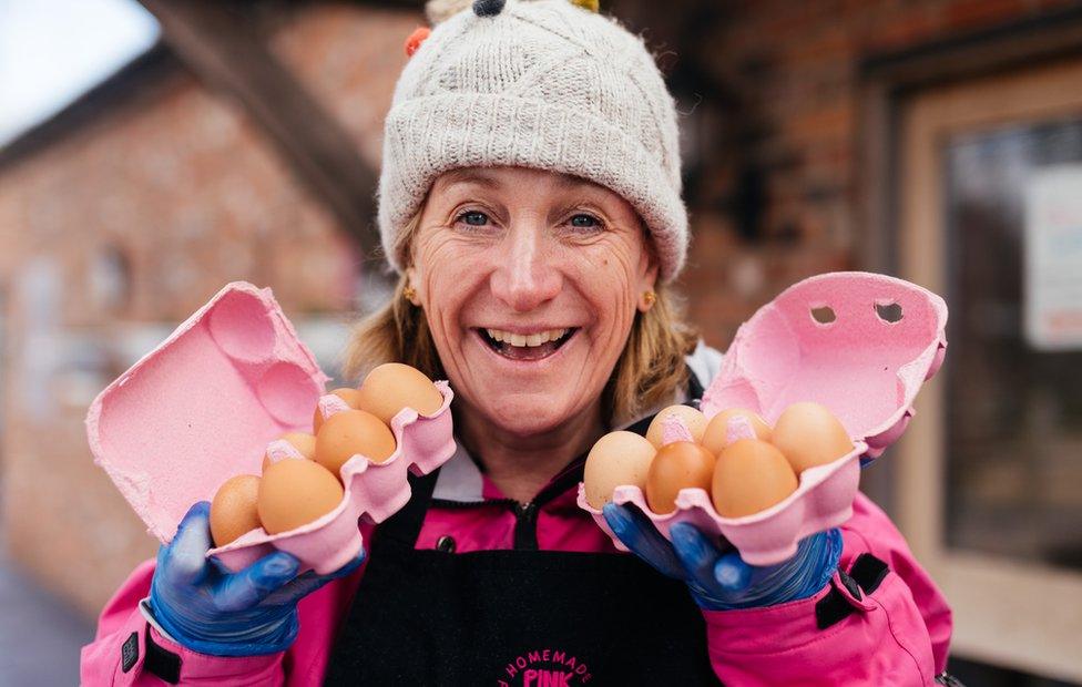 Anna's Mum with two boxes of eggs