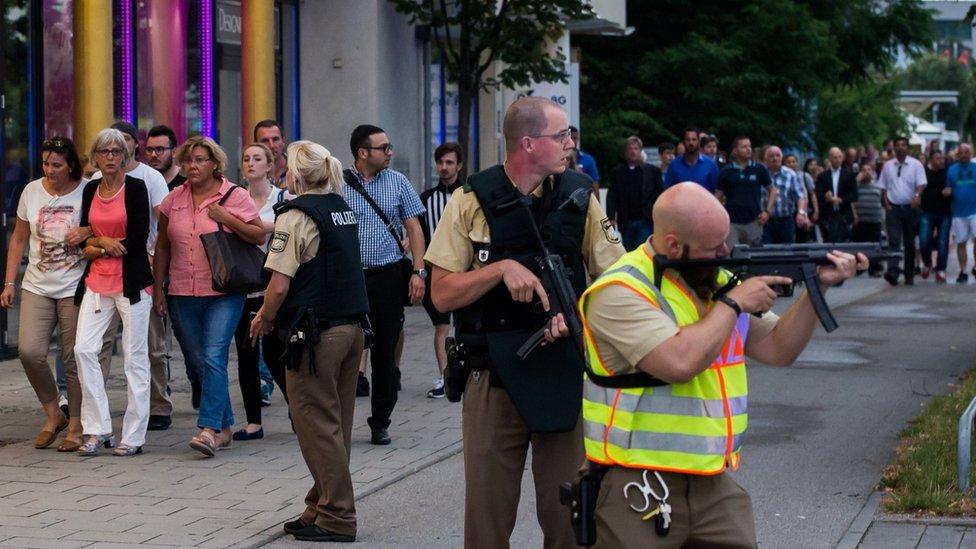 Police protest people evacuated from shopping centre in Munich. 22 July 2016