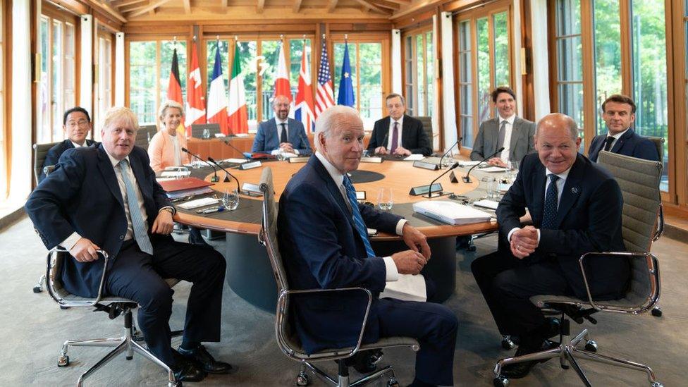 G7 leaders sitting together around a table