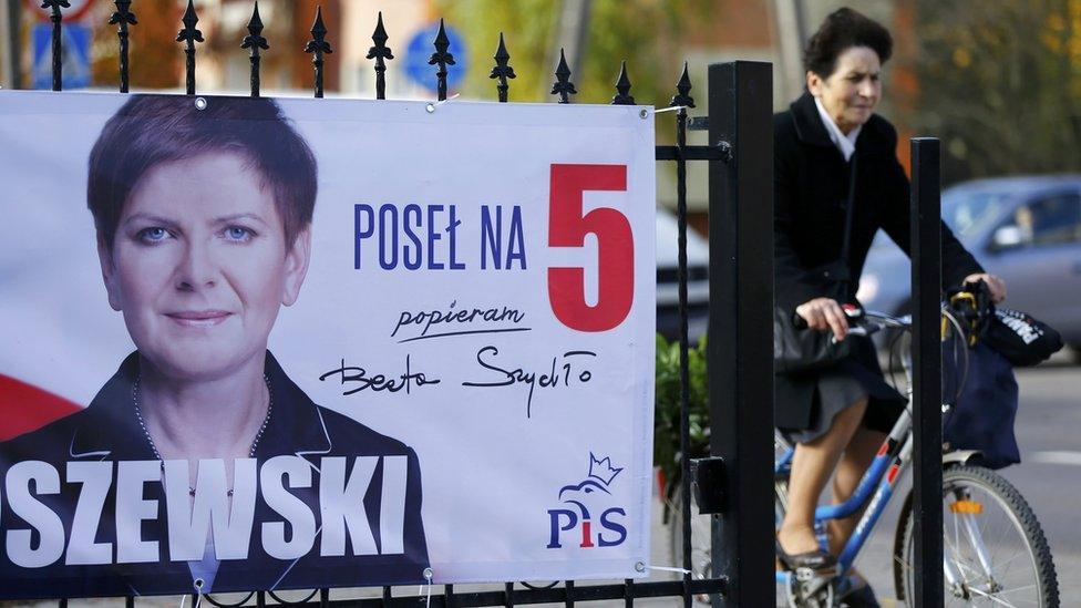 An election poster depicting Law and Justice"s (PiS) candidate for Prime Minister Beata Szydlo is seen in Leczyca, Poland