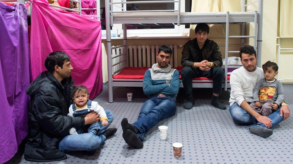 Afghan migrants sit in their room in the initial reception centre for asylum seekers in a former miners' hospital in Gera, central Germany (18 Feb. 2016)