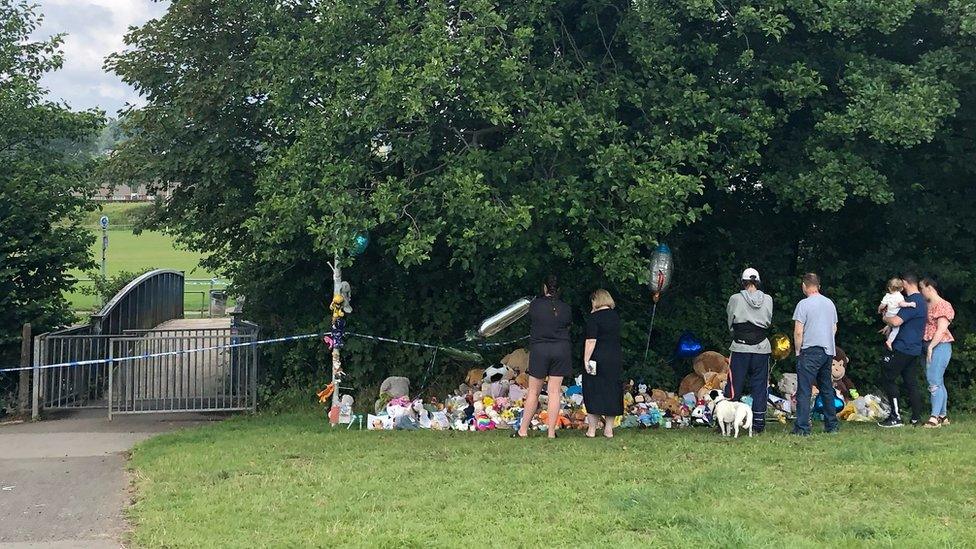 Grieving neighbours and friends leaving tributes to Logan