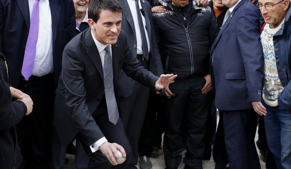 Manuel Valls, French Prime Minister, tries his hand at petanque on a visit to Bourg-Saint-Andeol in eastern France in March 2015