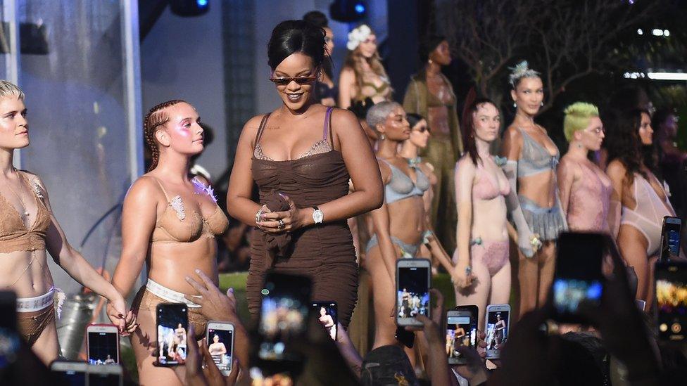 Rihanna walking the runway during the finale of the Savage X Fenty fashion show