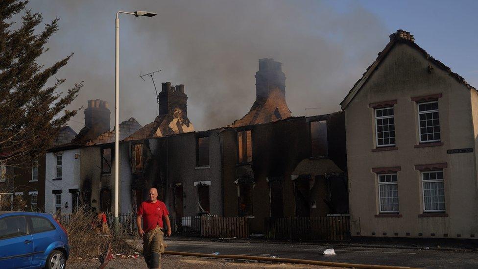 Emergency services at the scene of a blaze in the village of Wennington, east London.