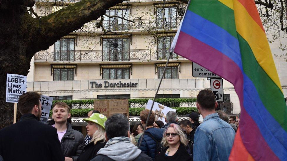 Protestors outside The Dorcester hotel on Park Lane, London