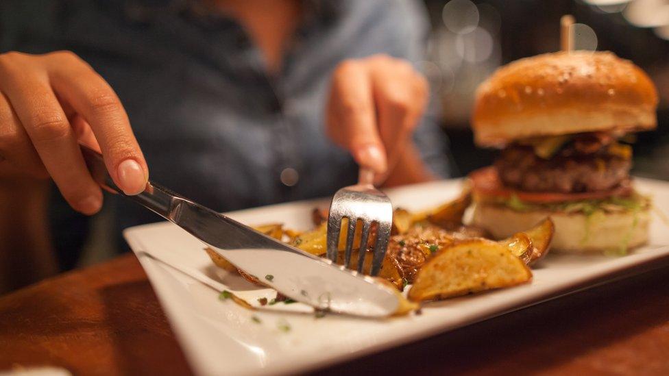 Woman eating burger