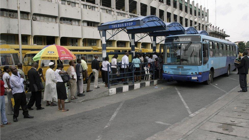 Commuters queue to board the Bus Rapid Transit (BRT) established to alleviate transportation problems in Lagos on 11 March 11 2009.