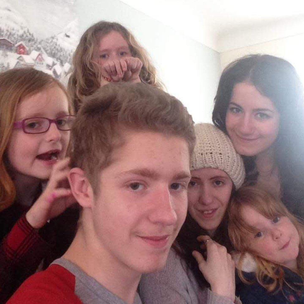 Mark with his sisters (clockwise)Sophie, Caitlin, Kelly, Megan and Lauren