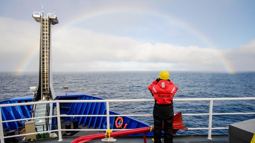 a rainbow seen from the boat