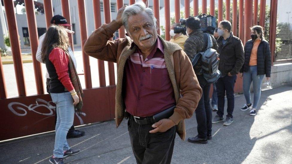 Jorge Hernandez gestures while waiting for news about his 28-year-old nephew Daniel, who had been seriously injured during the accident