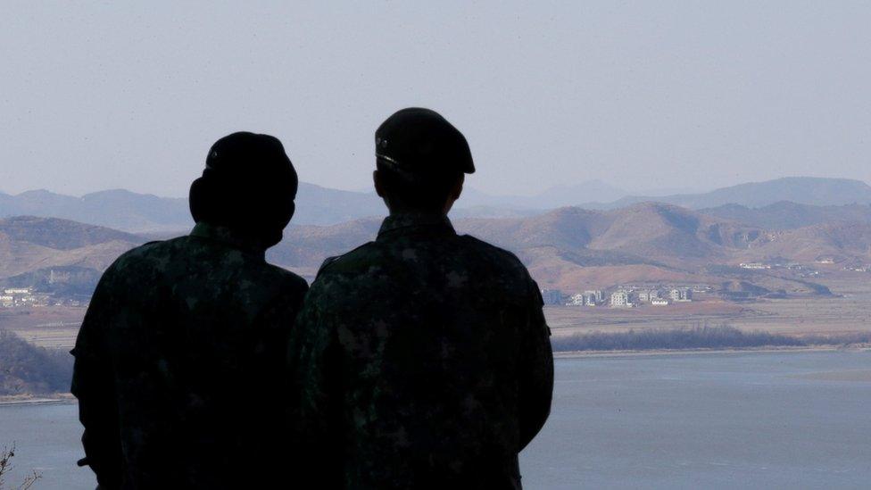 South Korean army soldiers watch the North Korean side at the unification observation post in Paju, near the border with North Korea, South Korea, 23 February