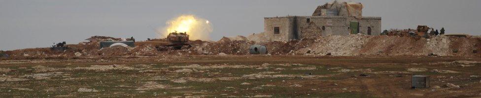 A Turkish tank fires towards the northern Syrian town of al-Bab, Syria, 14 January