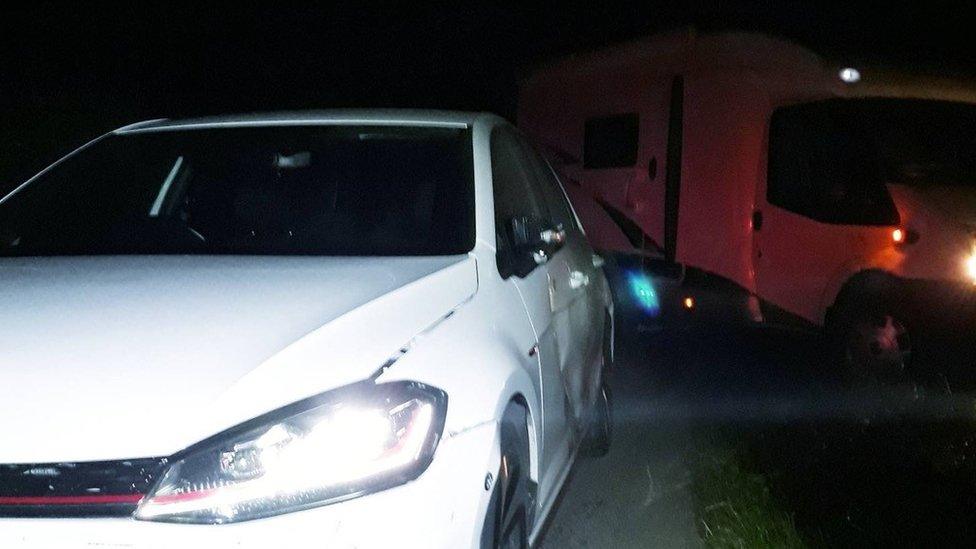 Damaged stolen motorhome and police vehicle