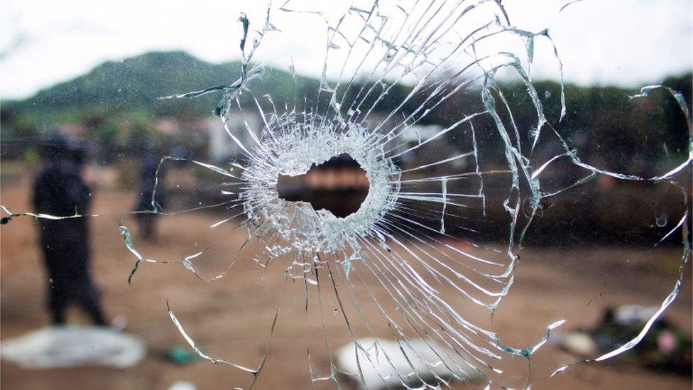 A window with a bullet hole.