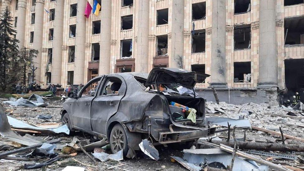 A view of damaged Kharkiv governor's office and a wrecked vehicle is seen after Russian army's missile attack in Kharkiv, Ukraine on March 01, 2022