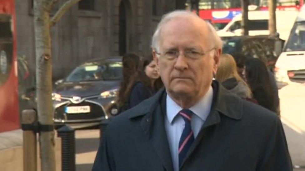Dr Alan Billings arrives at the High Court in London