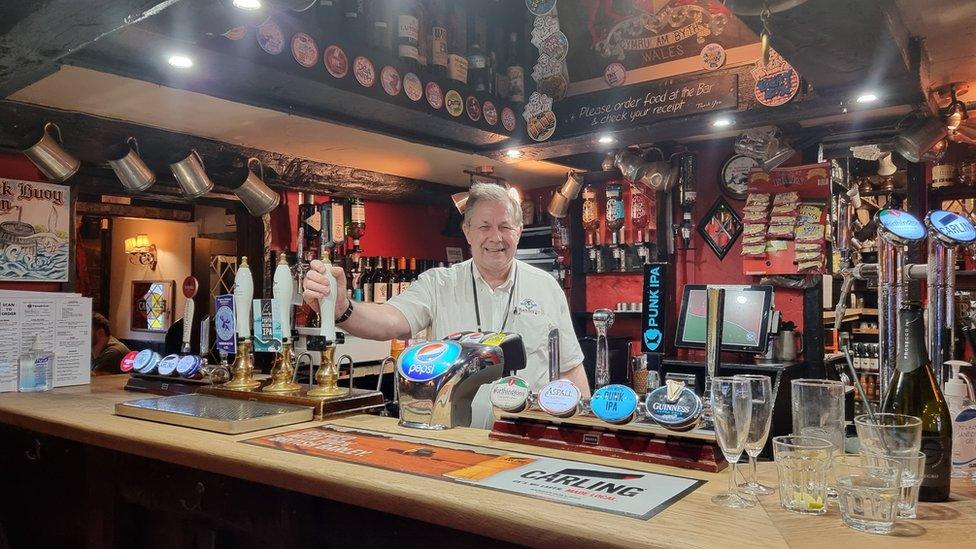 John Evans behind the bar of the Black Boy Inn