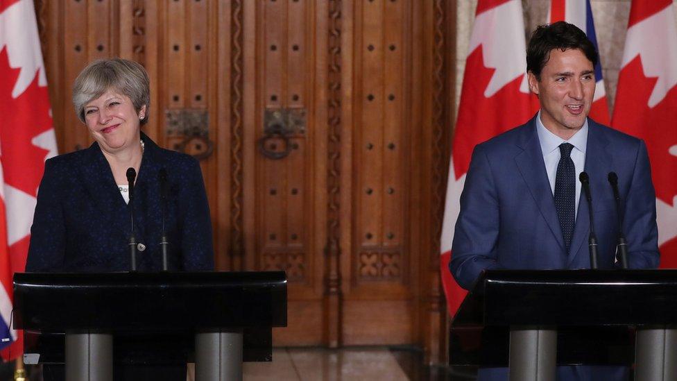 Theresa May and Justin Trudeau at a joint press conference