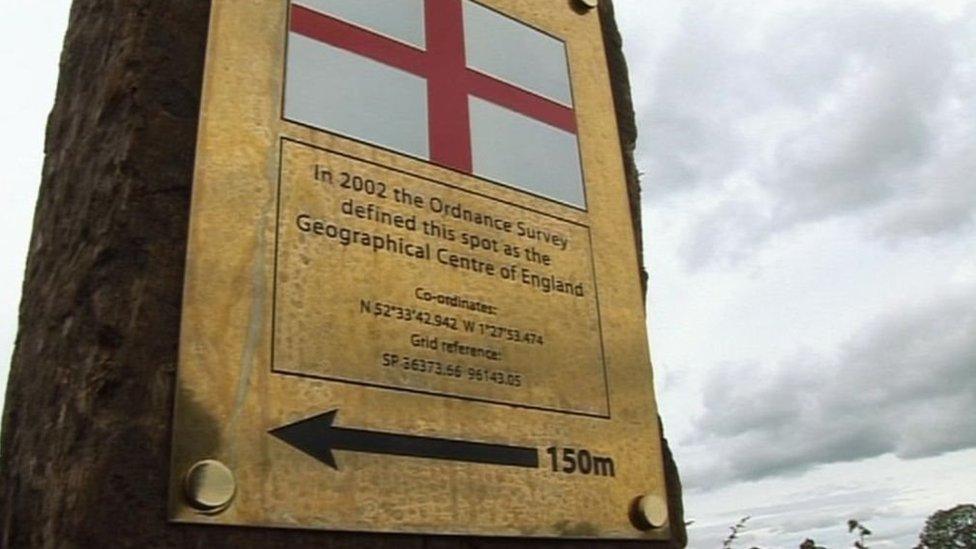 Still image showing plaque to mark centre of England
