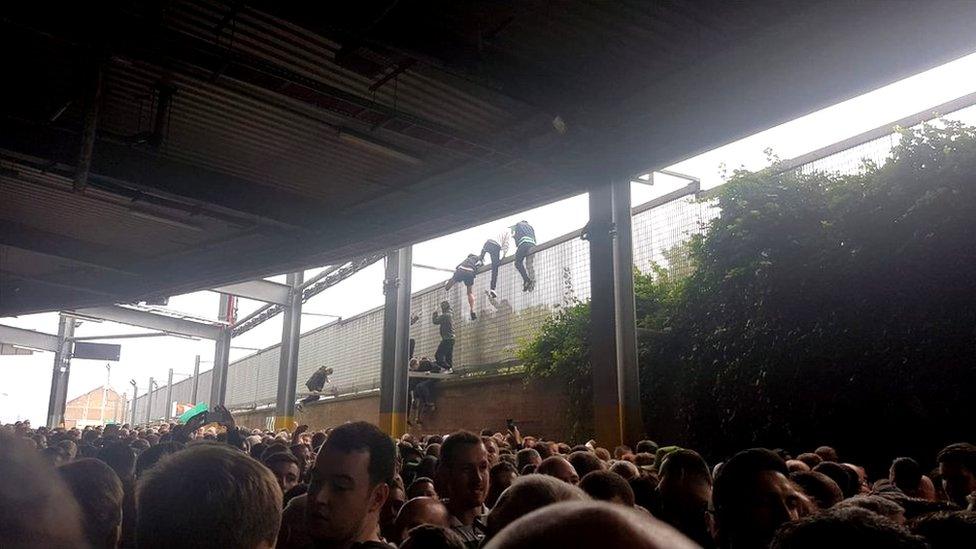 Fans climbing out of the ground