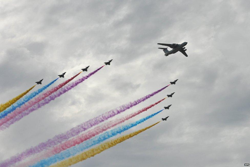 A formation of military aircraft performs during a rehearsal ahead of celebrations to mark the 70th anniversary of the end of World War Two, in Beijing on 23 August 2015.