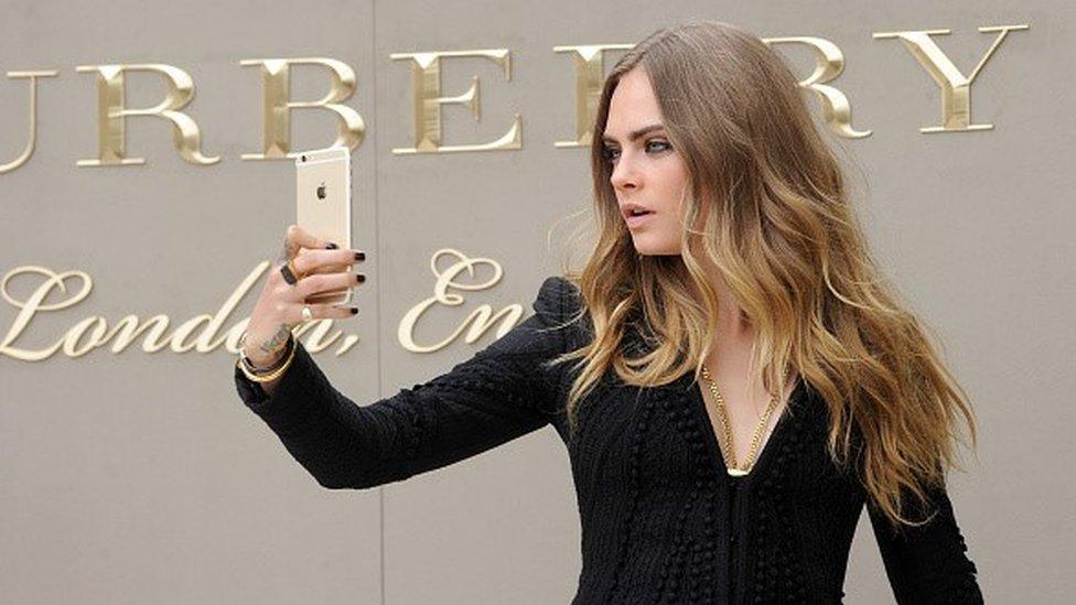 Cara Delevingne attends the Burberry Womenswear Spring/Summer 2016 show