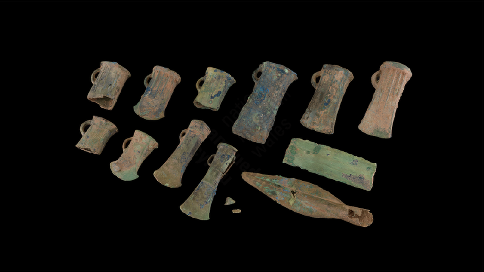 Hoard of 12 bronze spearheads, sword pieces and axes