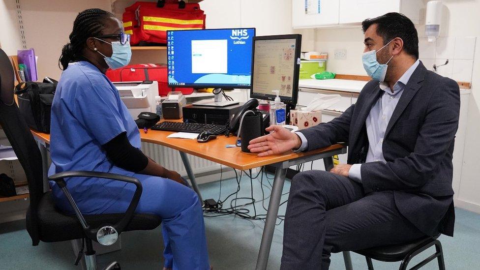 Health Secretary Humza Yousaf chats with physician associate Peju Adeyemo at Bangholm Medical Centre in Edinburgh