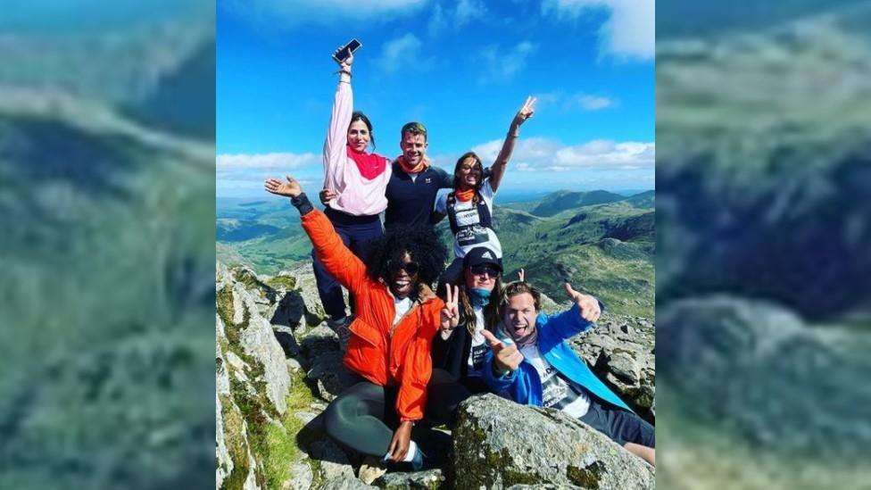 Olly and friends after walking up a peak