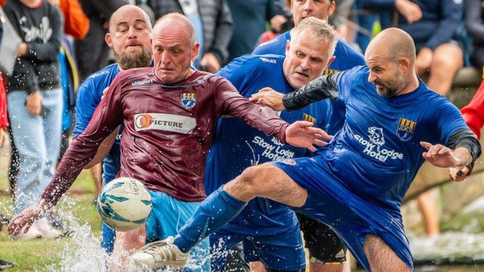 Bourton-on-the-Water football in the river