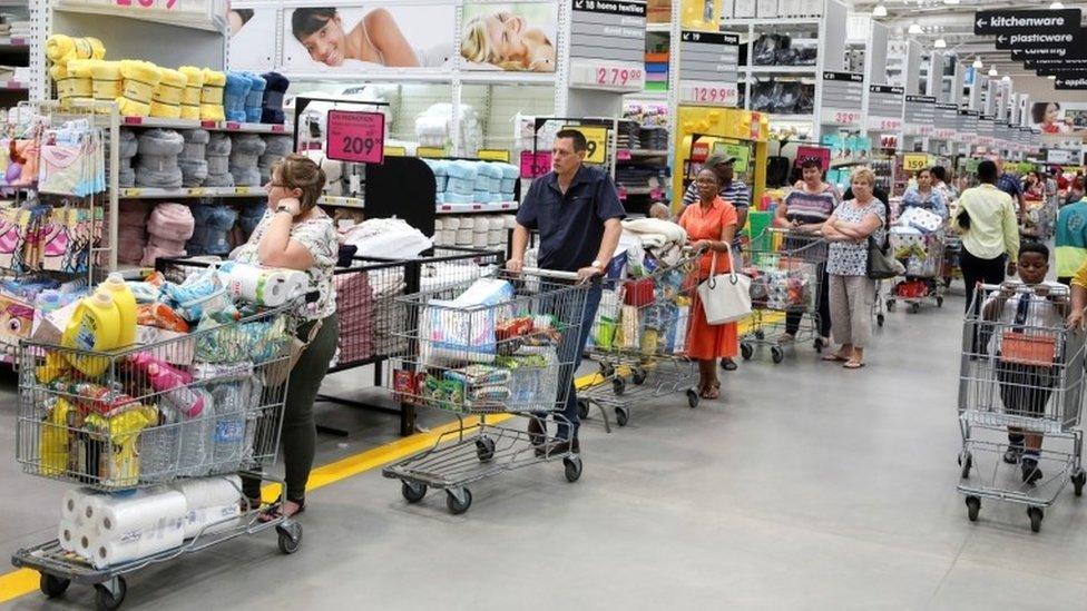 Shoppers stock up on groceries at a Makro store in Johannesburg, South Africa, 16 March 2020