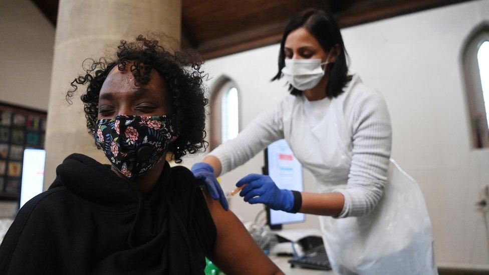 Woman receiving her vaccine